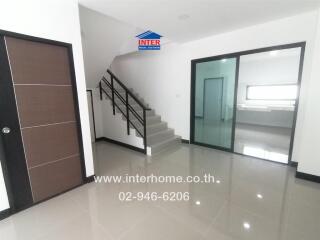 Modern building interior with staircase and glass doors