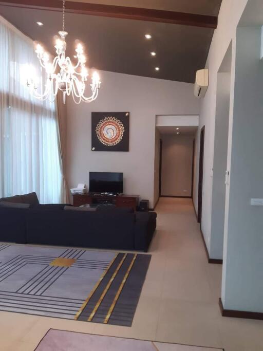 Living room with chandelier and art on wall