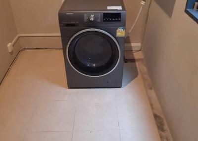 Laundry room with washer
