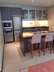 Modern kitchen with island and stainless steel appliances