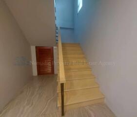 Interior staircase with wooden steps