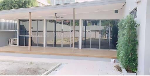 Modern outdoor patio area with glass sliding doors