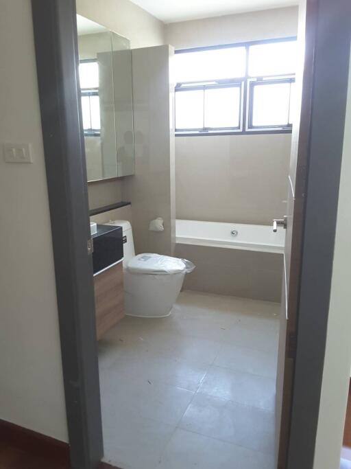 Modern bathroom with bathtub and toilet