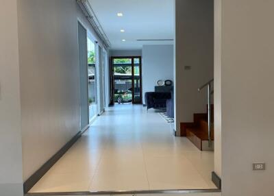 Spacious hallway with view of living area