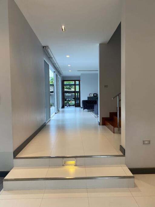 Spacious hallway with view of living area