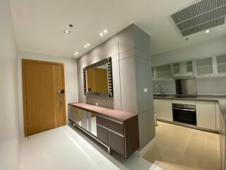 Modern kitchen area with integrated stainless steel appliances and stylish cabinetry.