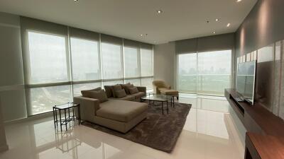 Modern living room with large windows and city view