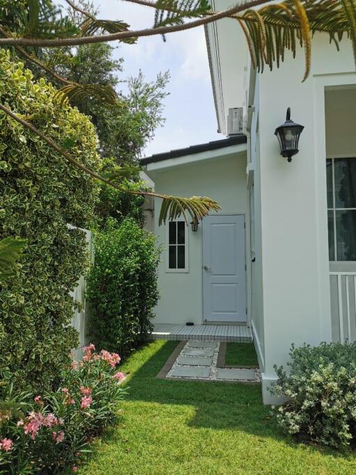 Side view of residential property with garden