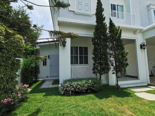 Exterior view of a modern house with a garden