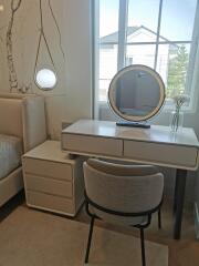 Bedroom with modern furniture and makeup desk