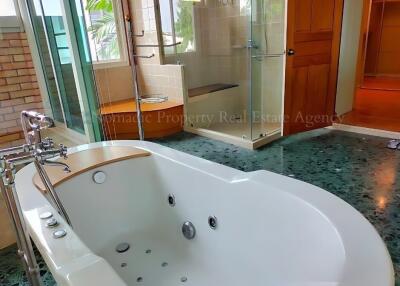 Spacious bathroom with jacuzzi tub and walk-in shower