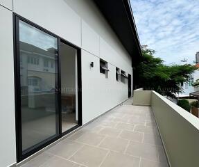 Spacious balcony with modern design and greenery view