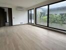 Spacious living room with large windows and garden view