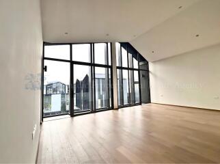 Spacious living room with large windows