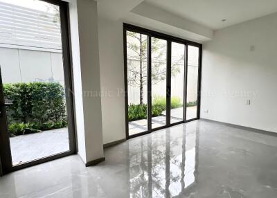 Living room with large windows and garden view