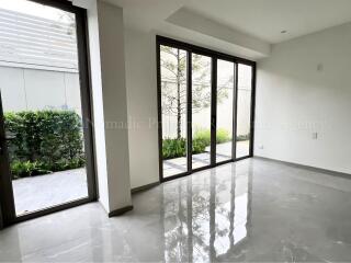 Living room with large windows and garden view