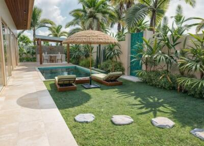 Tropical-themed backyard with pool and lounge chairs