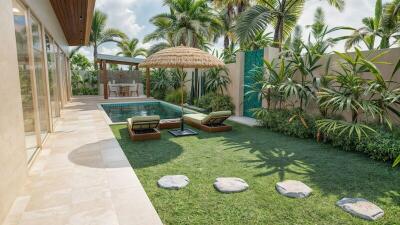 Tropical-themed backyard with pool and lounge chairs