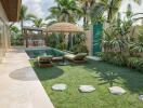 Tropical-themed backyard with pool and lounge chairs