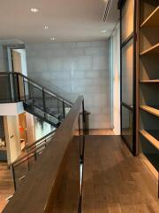 Modern interior with staircase and shelving