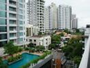 View of buildings with a pool in the foreground