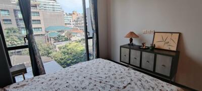 Bedroom with a view of a cityscape