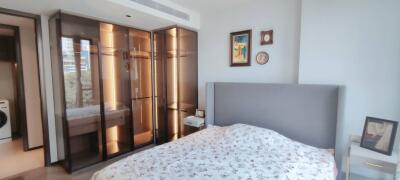 Modern Bedroom with Glass Closet and Grey Upholstered Headboard