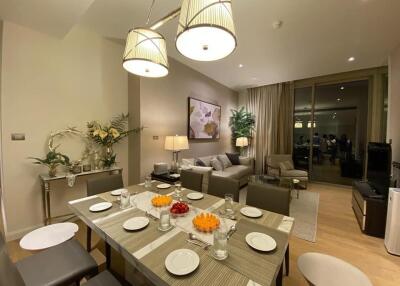 Modern living and dining area with a set dining table and cozy seating