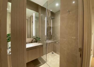 Modern bathroom with a glass-enclosed shower and vanity