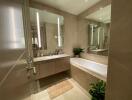 Modern bathroom with double vanity and bathtub