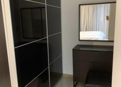 Modern bedroom with wardrobe and vanity table with mirror