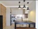 Modern kitchen and dining area with lighting fixtures