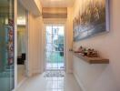 Modern hallway with glass doors and floating shelf