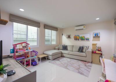 Living room with sectional sofa, children