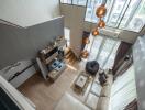 Modern living room with high ceiling and large windows