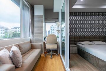 Bright bedroom with a study area and large windows