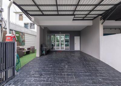 Spacious covered garage with a grill and outdoor seating