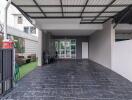 Spacious covered garage with a grill and outdoor seating