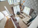 Spacious living room with high ceiling and modern decor