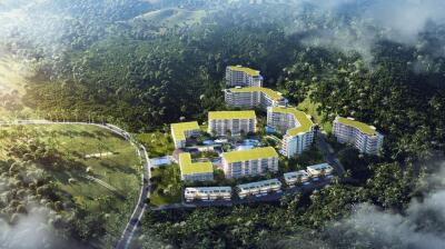 Aerial view of a residential complex surrounded by dense greenery