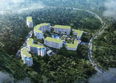 Aerial view of residential buildings surrounded by forest