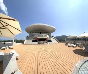 Modern roof deck with seating and shade umbrellas