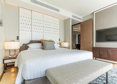 Modern bedroom with king-sized bed and decorative wall panels