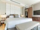 Modern bedroom with king-sized bed and decorative wall panels
