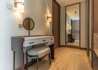 Bedroom with vanity table and large mirror