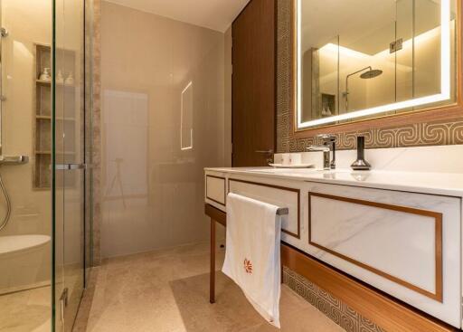 Modern bathroom with glass shower and large mirror