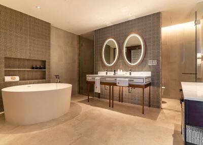 Modern bathroom with double sinks and freestanding bathtub