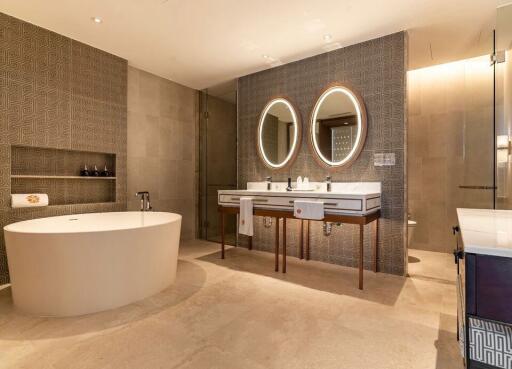 Modern bathroom with double sinks and freestanding bathtub