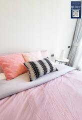 Cozy bedroom with pastel-colored bedding