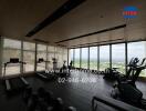 Spacious gym with large windows and city view